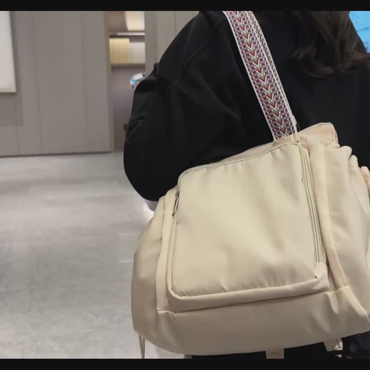 Gym bag with drawstring and multiple pockets